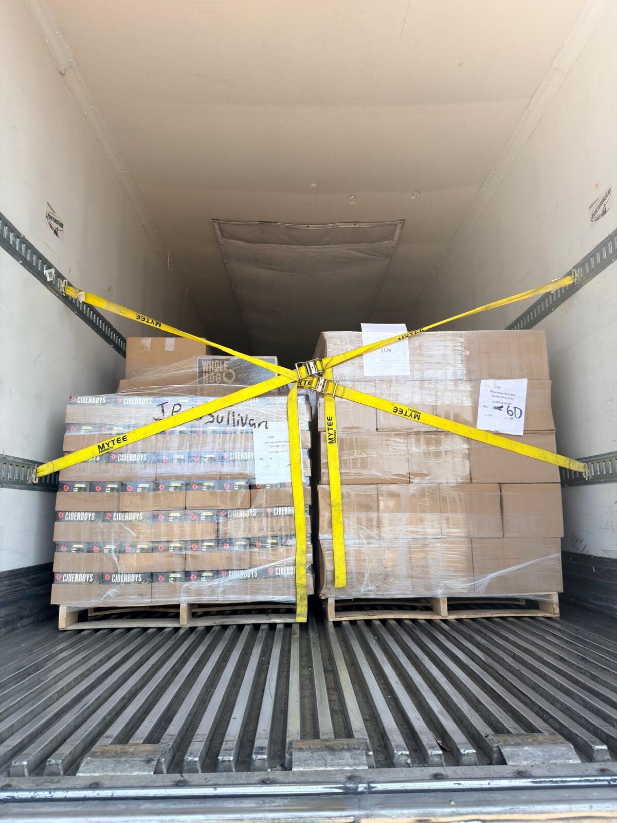 Palletized beverage cartons secured inside a DT Trans LLC trailer